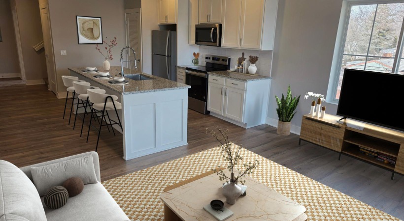a living room with a large kitchen