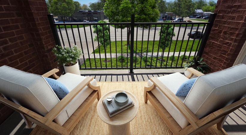 a patio with a table and chairs
