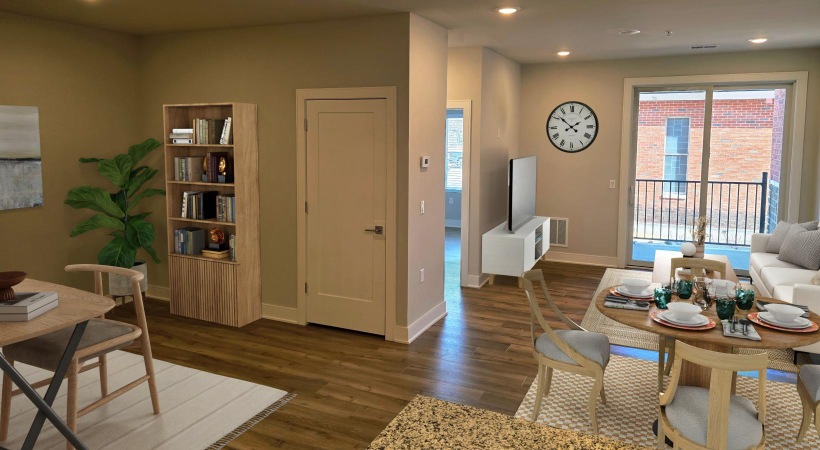 a living room with a table and chairs
