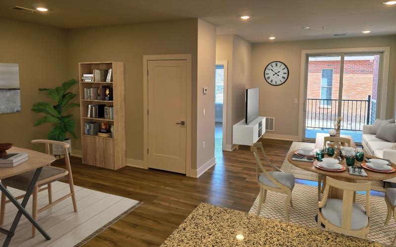 a living room with a table and chairs